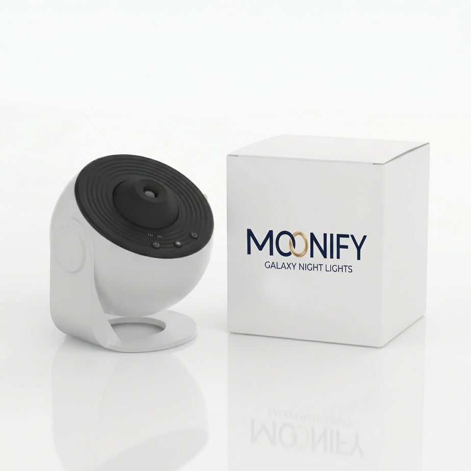 A white and black Moonify Galaxy Night Lights security camera shown next to its white product box on a clean white background.