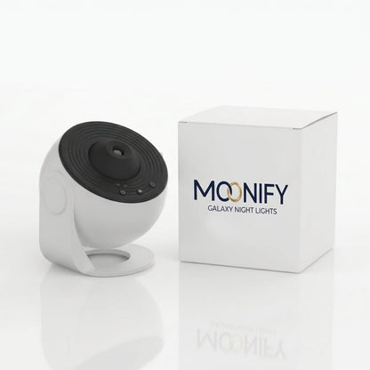 A white and black Moonify Galaxy Night Lights security camera shown next to its white product box on a clean white background.