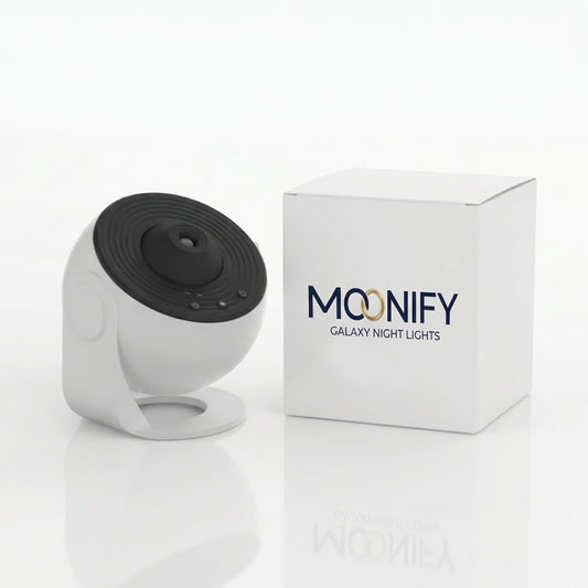 A white and black Moonify Galaxy Night Lights security camera shown next to its white product box on a clean white background.